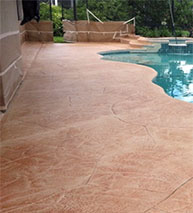 Concrete pool deck with acid stain